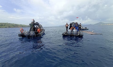 Indonesian rescuers find body while searching for Spanish soccer coach, 3 children