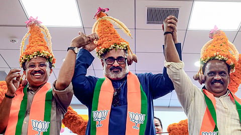 BJP candidates V Muraleedharan, left, Rajeev Chandrasekhar, centre, and BB Gopakumar, arrive at party headquarters after the Assembly elections result, in Thiruvananthapuram, Kerala, Tuesday, May 5, 2026.