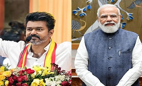 PM Modi (R) congratulates TVK chief Vijay (L) on taking oath as Tamil Nadu CM