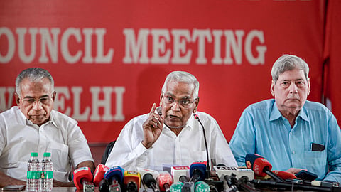 General Secretary of CPI D Raja, centre, addresses a press conference at Ajoy Bhavan, in New Delhi, Monday, May 11, 2026.