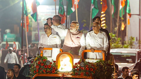 Prime Minister Narendra Modi greets the supporters during a roadshow, in Vadodara on May 11, 2026.