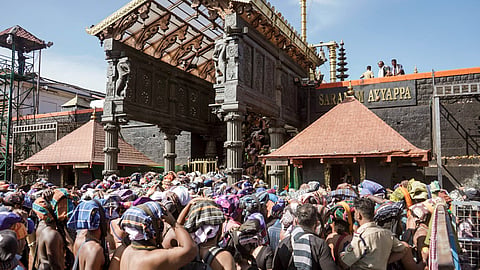 People wait in queues to offer prayers at the Sabarimala temple, in Pathanamthitta district, Kerala, Monday, Jan. 5, 2026.