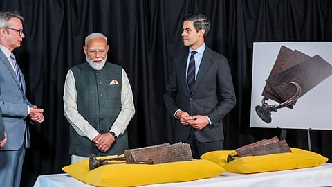 PM Narendra Modi receives the 11th-century Chola dynasty copper plates, which are being handed back to India during a restitution ceremony in The Hague on May 16, 2026.