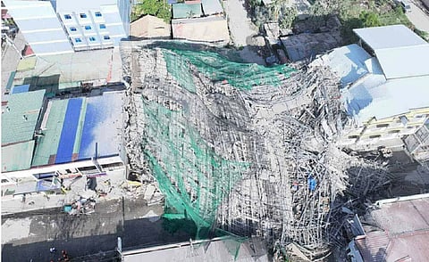 Nine-storey building being constructed in Philippines collapses, trapping dozens of workers