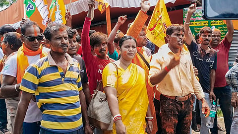 BJP supporters celebrate outside a counting centre, at Falta, in South 24 Parganas district, West Bengal, Sunday, May 24, 2026. BJP candidate Debangshu Panda was leading after several rounds of counting in the repoll to the Falta assembly constituency.