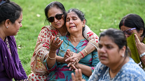 Rekha Sharma, mother of former model-turned-actor Twisha Sharma, and other family members, mourn during the last rites of Twisha, at Bhadbhada Vishram Ghat in Bhopal, Sunday, May 24, 2026.