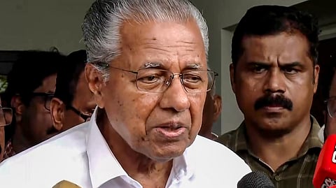 Former Kerala Chief Minister Pinarayi Vijayan speaks to the media after the Enforcement Directorate (ED) conducts a raid at his residence as part of ED's investigation in the CMRL money laundering case, in Thiruvananthapuram, Wednesday, May 27, 2026.