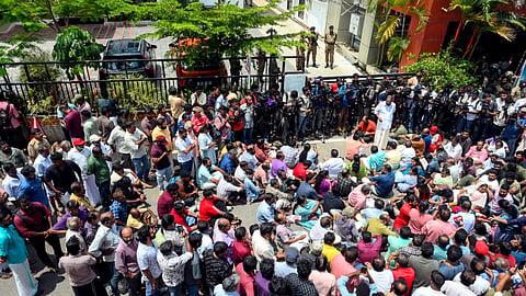CPI(M) workers protest outside former Kerala Chief Minister Pinarayi Vijayan's Thiruvananthapuram residence on Wednesday, May 27, 2026, in response to an Enforcement Directorate raid.