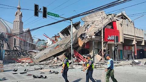 A 7.8 magnitude quake in Philippines kills at least 19, fells buildings and sets off tsunami