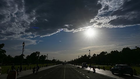 Dark clouds hover over the sky near India Gate, in New Delhi, Monday, June 15, 2026.