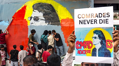 People re-paint the mural of late music icon Zubeen Garg, beneath the Ganeshguri flyover, after it was painted over, in Guwahati, Thursday, June 18, 2026.