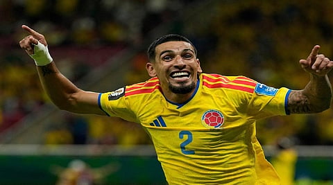 Daniel Munoz scores and Colombia edges Congo 1-0 to reach the knockout stage at the World Cup