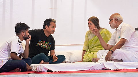 Activist Sonam Wangchuk and Cockroach Janta Party (CJP) founder Abhijeet Dipke interact with CPI(M) General Secretary MA Baby and party leader Brinda Karat during an indefinite hunger strike at the Jantar Mantar to press for Education Minister Dharmendra Pradh's resignation over alleged exam irregularities, in New Delhi, Monday, June 29, 2026.