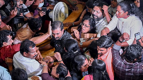 BJP and UDF councillors scuffle during a corporation council meeting over the demand for the ouster of BJP councillor R. Sugathan, who was arrested under the Kerala Anti-Social Activities (Prevention) Act (KAAPA), in Thiruvananthapuram, Monday, June 29, 2026.