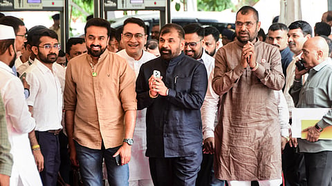 Shiv Sena (UBT) MLC Sachin Ahir, centre, arrives during Monsoon session of the Maharashtra Assembly, in Mumbai, Wednesday, July 1, 2026. Ahir was elected unopposed to the post of deputy chairman of the Maharashtra legislative council as a candidate of the ruling Mahayuti on Wednesday.