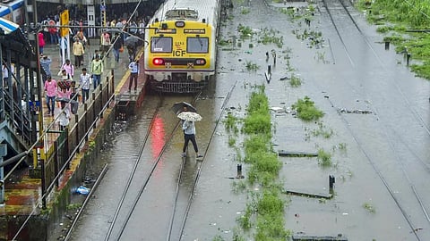 Heavy showers flood parts of Mumbai, slow road traffic and trains