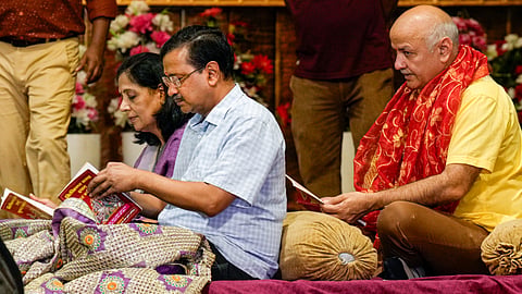 AAP National Convenor Arvind Kejriwal, with his wife Sunita Kejriwal and party leader Manish Sisodia, attends a 'Sundarkand Path', in New Delhi, Sunday, July 12, 2026.