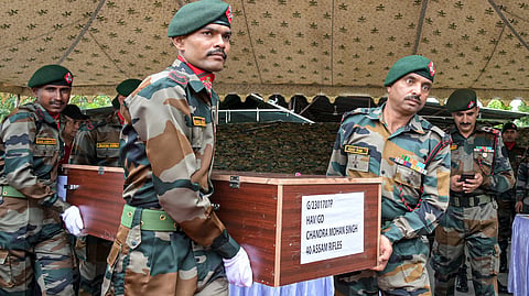 Army personnel carry the coffins of two Assam Rifles personnel, who were killed in an attack by suspected militants in Ukhrul district, after a wreath-laying ceremony at Bir Tikendrajit International Airport, in Imphal, Manipur, Wednesday, July 8, 2026.