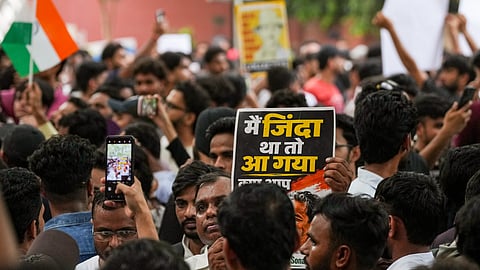 Cockroach Janata Party (CJP) supporters during a protest demanding Union Education Minister Dharmendra Pradhan's resignation over alleged irregularities in the NEET examination, at the Jantar Mantar in New Delhi, Sunday, July 19, 2026.