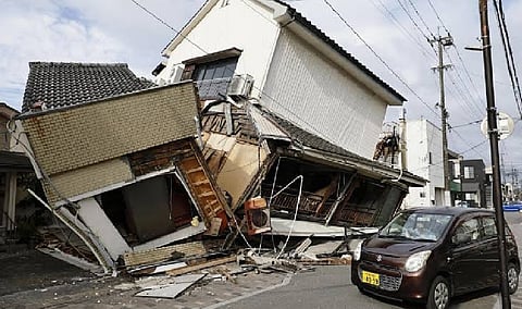 Death toll rises to 13 as rescuers search for the missing after Japan earthquake