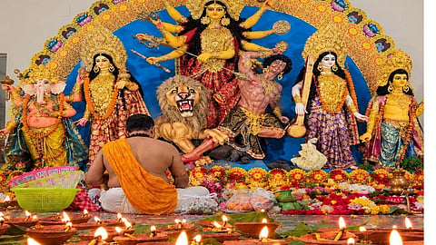Ma Durga deity with Prist