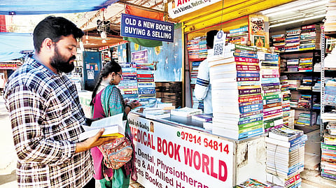The vendors beckon me toward their maze of literary wonders, including classics, best-selling novels, and academic textbooks.