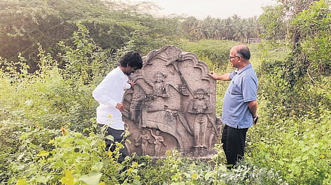 The stone depicts a warrior riding on a horse.