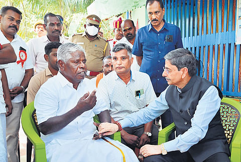 Governor RN Ravi visiting the Keezhvenmani massacre survivor G Palanivel at his residence in Keezhvenmani on Sunday.
