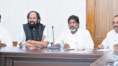Irrigation Minister Uttam Kumar Reddy speaks during a meeting on Friday