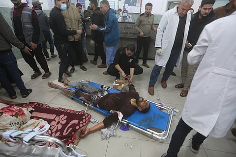 A Palestinian wounded in the Israeli bombardment of the Gaza Strip is treated at a hospital in Rafah on Tuesday, Jan. 16, 2024.