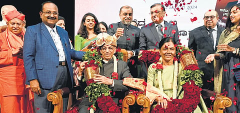 Justice Shivaraj V Patil and his wife being felicitated in Bengaluru on Sunday.