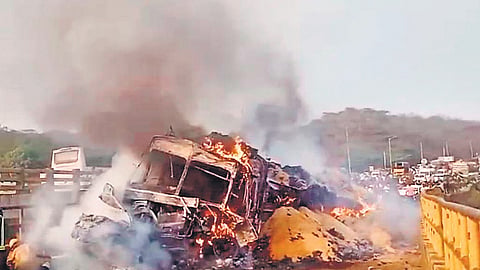 The truck driver lost control and rear-ended three cars and two other trucks. Two cars were trapped under the truck and went up in flames