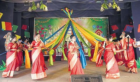 Women members of Telugu community performing at Prakasham hall on Sunday.
