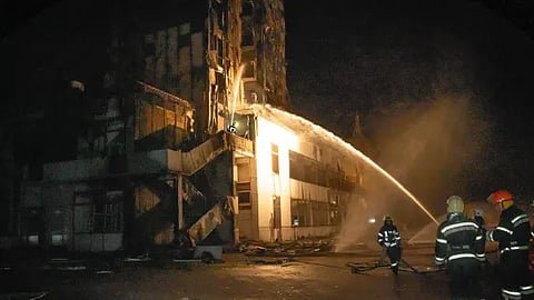 Firefighters work to extinguish a blaze in a hotel at the seaport after a Russian rocket attack in Odesa, Ukraine.