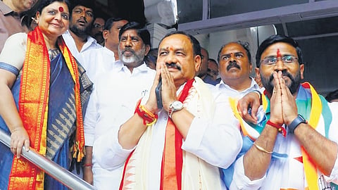 Congress candidates Mahesh Kumar Goud and Balmoor Venkat greet party workers and leaders after filing their nomination papers on Thursday