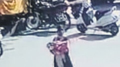 A CCTV grab showing the accused woman carrying the infant away from the hospital in Karimnagar on Saturday