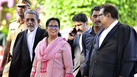 Vadakara MLA K K Rema, wife of TP Chandrasekharan, at the High Court with Advocate P Kumarankutty.