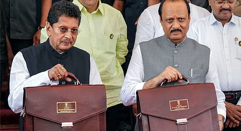 Maharashtra Dy CM Ajit Pawar along with Cabinet Minister for Ministry of Education and Ministry of Marathi Deepak Kesarkar arrives to present the State Budget 2024-25 in the Assembly, at Vidhan Bhavan, in Mumbai.