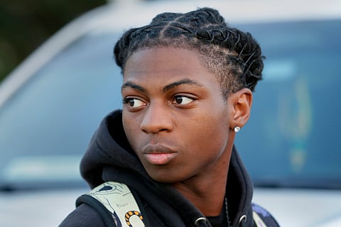 Darryl George, a 17-year-old junior, before walking across the street to go into Barbers Hill High School after serving a 5-day in-school suspension for not cutting his hair, Sept. 18, 2023, in Mont Belvieu, Texas.
