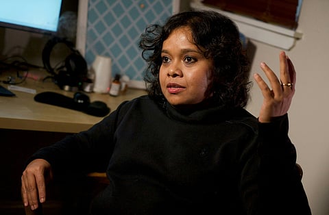 Shreya Datta, a tech professional who was a victim of an online scam known as "pig butchering," speaks during an interview with AFP in her apartment in Philadelphia.