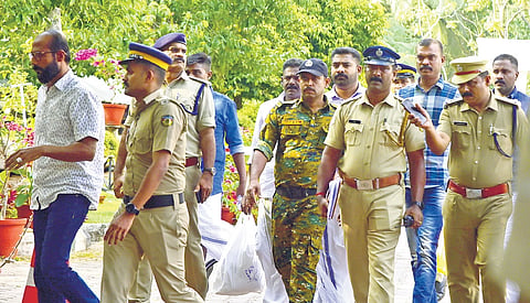 Police officers taking the TP Chandrasekharan murder case convicts to the High Court in Kochi on Monday.