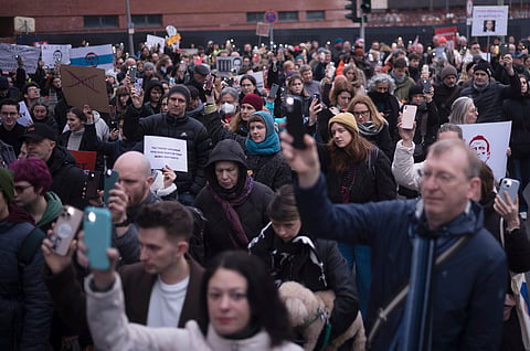 People attend a protest march near the Russian embassy in Berlin, on Sunday, Feb. 18, 2024, to commemorate Russian opposition leader Alexei Navalny.