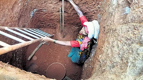 Gowri C Naik gets to work, digging a well for the Anganawadi, in Ganeshnagar, near Sirsi, in Uttara Kannada district