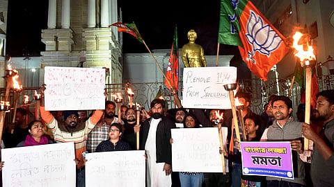 Activists of BJP Yuva Morcha stage a protest against TMC workers who allegedly disrespected the modesty of women in Sandeshkhali, in Kolkata, Saturday, Feb. 10, 2024.