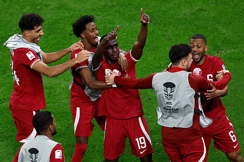 Almoez Ali celebrates scoring his team's third goal during the Asian Cup semi-final against Iran (Photo | AFP)