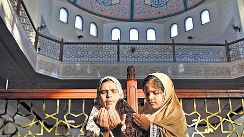 A woman and her daughter offer Namaz at Billal Masjid during ‘Masjid Darshan’ in Bengaluru on Saturday.