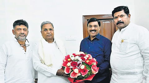 CM Siddaramaiah and Deputy CM DK Shivakumar meet MLA G Janardhana Reddy in Bengaluru on Monday. Koppal District Minister Shivaraj Tangadagi looks on