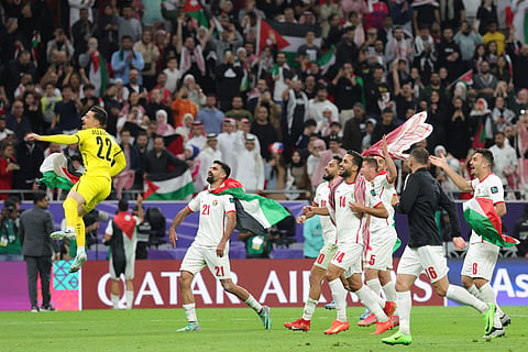 Jordan's players celebrate after defeating South Korea at the end of the Qatar 2023 AFC Asian Cup semi-final football match between Jordan and South Korea on February 6, 2024.