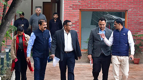Delhi Police Crime Branch officials at the residence of Delhi minister Atishi Singh to serve her a notice regarding investigation into AAP's claim that the BJP was trying to poach its MLAs, in New Delhi.