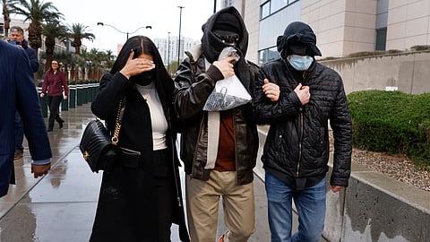 Former FBI informant Alexander Smirnov, center, leaves the courthouse on Tuesday, Feb. 20, 2024, in Las Vegas.